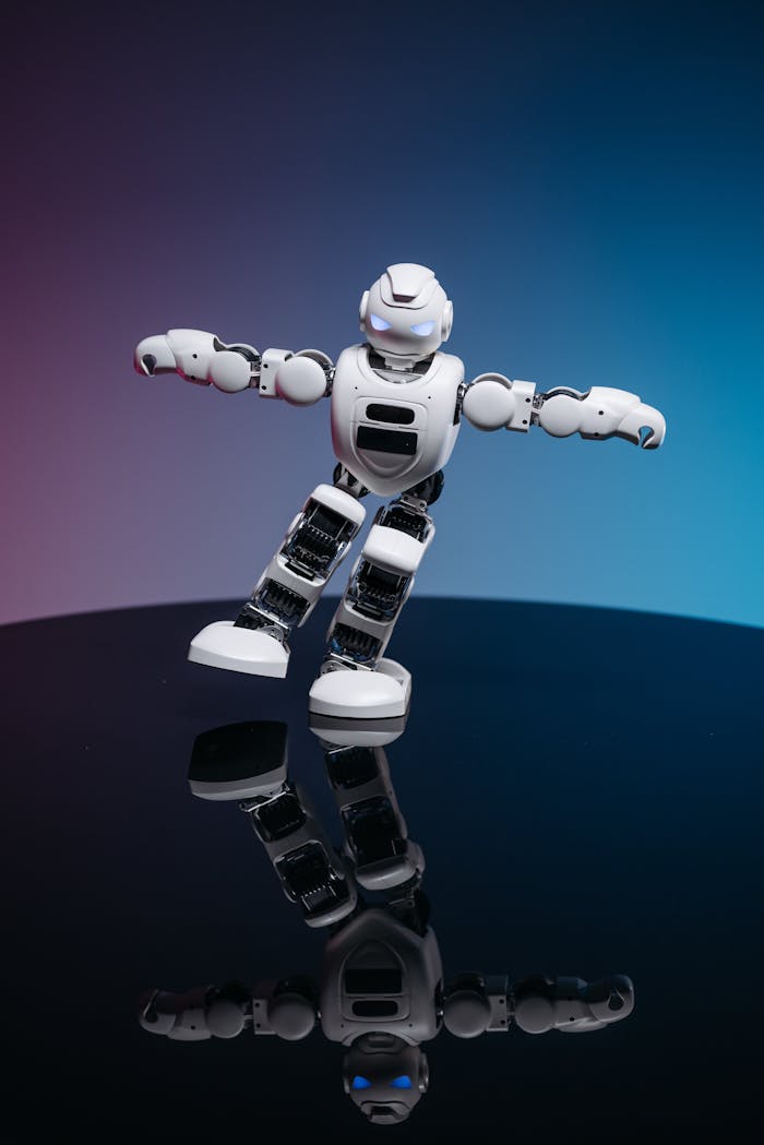 Close Up Shot of White Toy Robot on Blue and Pink Background